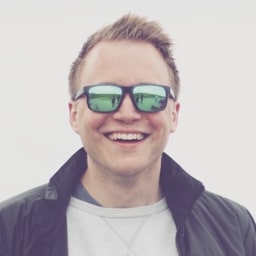Christian smiling and wearing sunglasses.